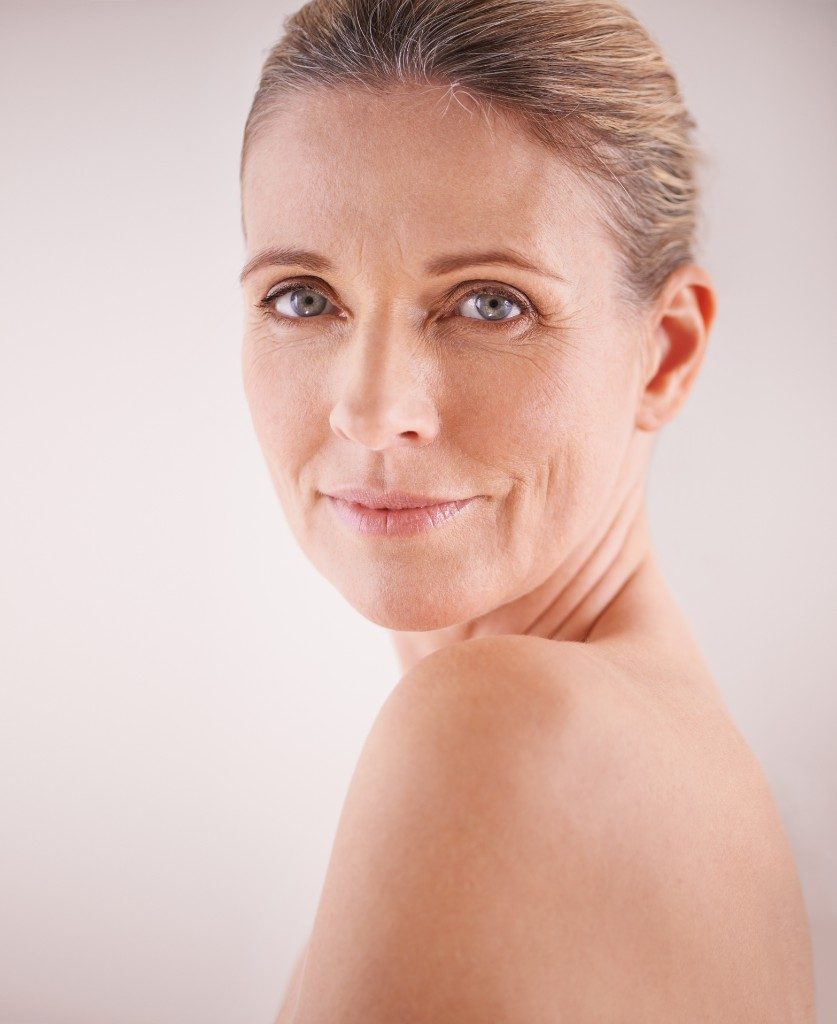 What Treatment Is Best for Loose Skin After Weight Loss? Woman with mild loose skin jawline non surgical skin tightening Lansing MI