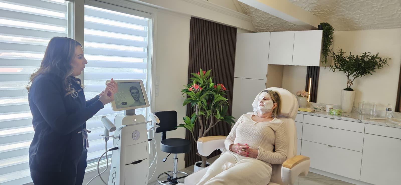 Provider preparing client for personalized injectable treatment at Maison Zolara, Lansing